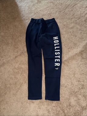 Hollister Navy Sweatpants with White Logo Down Leg